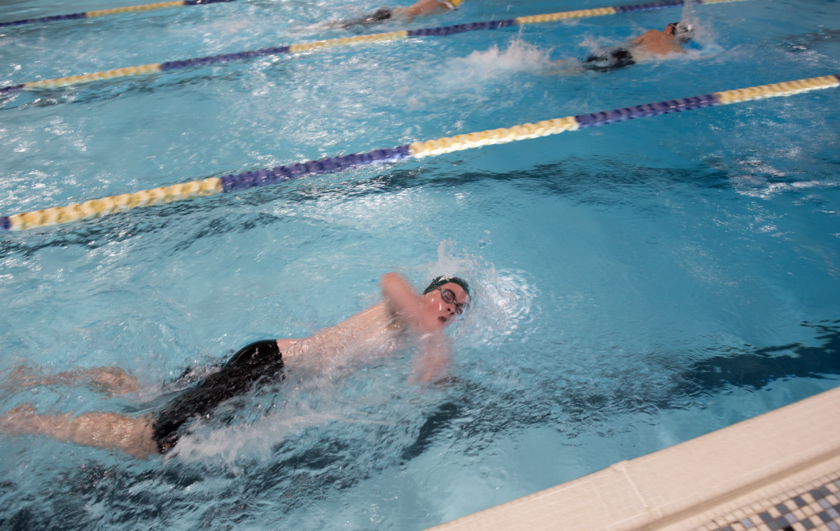 1.20.25 Freshman Christian Reck swimming the 100 yard freestyle at the senior recognition meet. 